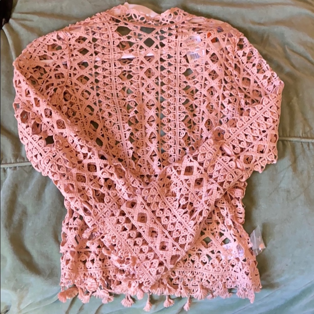 Crocheted baby pink top.
